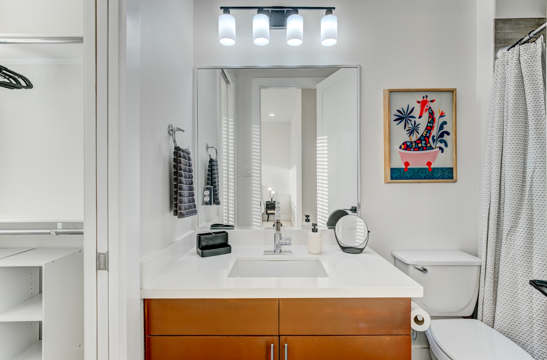 Guest bathroom with quartz vanity and tub/shower combo