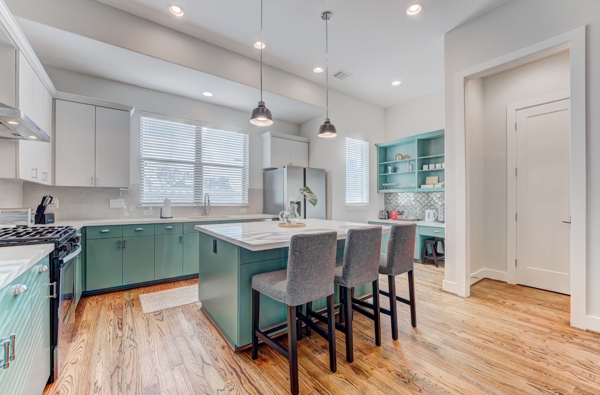 Kitchen with bar seating and coffee bar